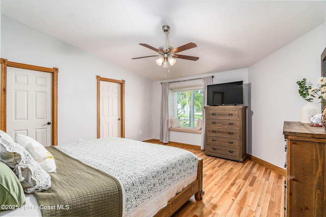 4027 Secretariat Ln, Malabar, FL 32950 - bedroom with light wood-type flooring, lofted ceiling, baseboards, and ceiling fan