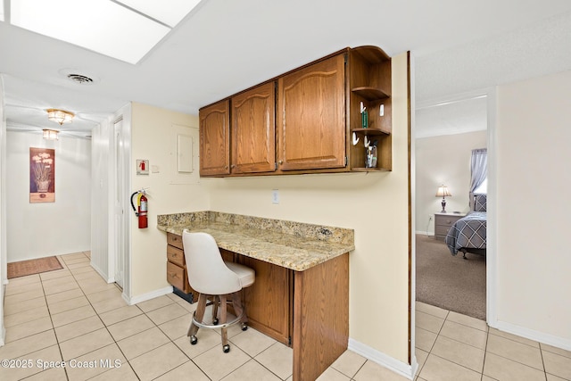 3170 N Atlantic Ave Unit 407, Cocoa Beach, FL 32931 - home office featuring light tile patterned flooring and baseboards