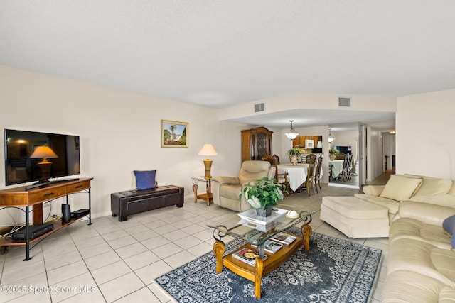 3170 N Atlantic Ave Unit 407, Cocoa Beach, FL 32931 - living area with light tile patterned floors and baseboards