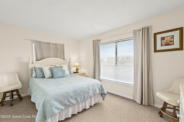 3170 N Atlantic Ave Unit 407, Cocoa Beach, FL 32931 - bedroom featuring carpet flooring, a textured ceiling, and baseboards