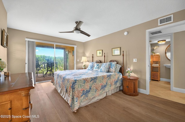 211 S 24th St Unit 202, Cocoa Beach, FL 32931 - bedroom with wood finished floors, access to exterior, baseboards, and ceiling fan