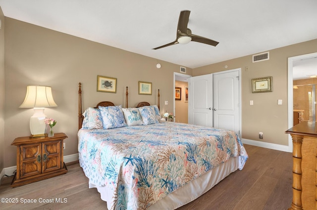 211 S 24th St Unit 202, Cocoa Beach, FL 32931 - bedroom with wood finished floors, baseboards, a closet, and a ceiling fan