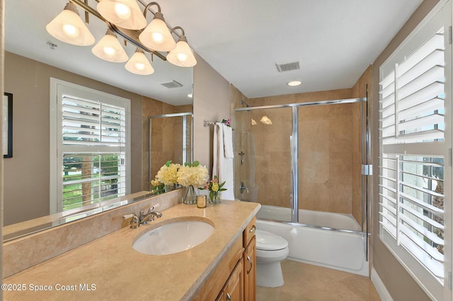 211 S 24th St Unit 202, Cocoa Beach, FL 32931 - full bath with vanity, toilet, tile patterned flooring, and combined bath / shower with glass door