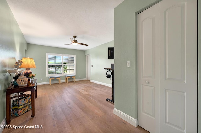 211 S 24th St Unit 202, Cocoa Beach, FL 32931 - living area with hardwood / wood-style flooring, ceiling fan, and baseboards