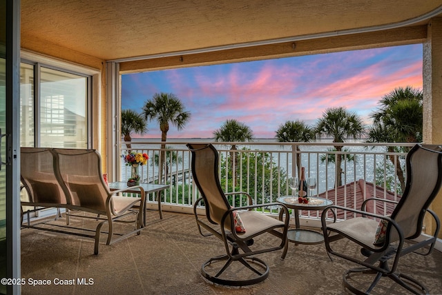 211 S 24th St Unit 202, Cocoa Beach, FL 32931 - view of balcony at dusk
