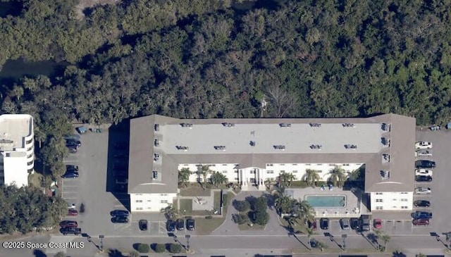 230 Columbia Dr Unit 213, Cape Canaveral, FL 32920 - aerial view of property and surrounding area with a forest