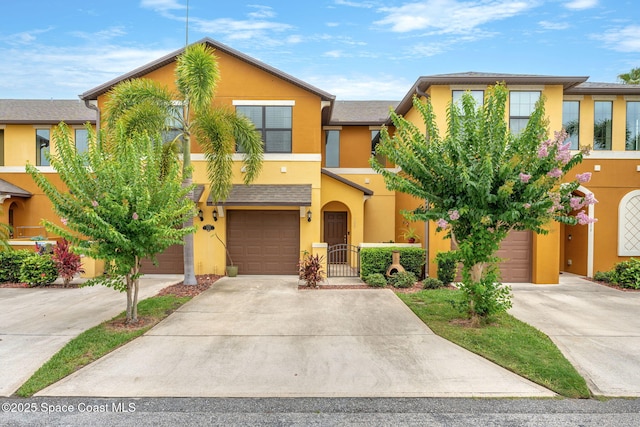 1415 Lara Cir Unit 105, Rockledge, FL 32955 - multi unit property featuring stucco siding, driveway, and a garage