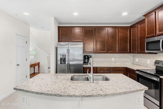 1415 Lara Cir Unit 105, Rockledge, FL 32955 - kitchen with stainless steel appliances, a sink, light stone counters, tasteful backsplash, and recessed lighting