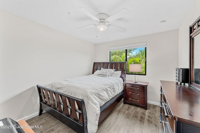 1415 Lara Cir Unit 105, Rockledge, FL 32955 - bedroom with light wood-style floors, baseboards, and a ceiling fan
