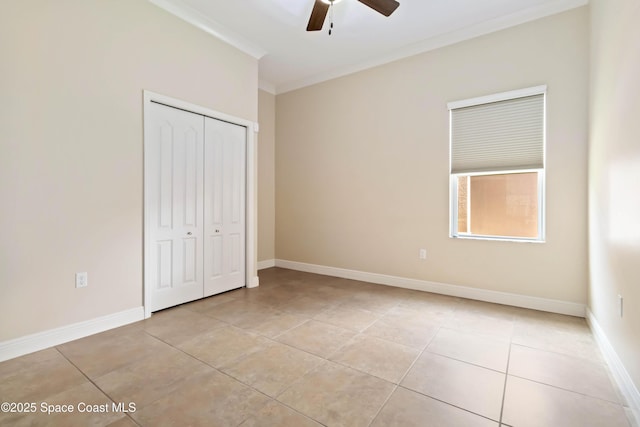3140 Constellation Dr, Melbourne, FL 32940 - unfurnished bedroom with ornamental molding, light tile patterned flooring, a closet, baseboards, and a ceiling fan