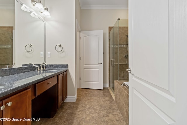3140 Constellation Dr, Melbourne, FL 32940 - bathroom with a stall shower, double vanity, crown molding, and baseboards