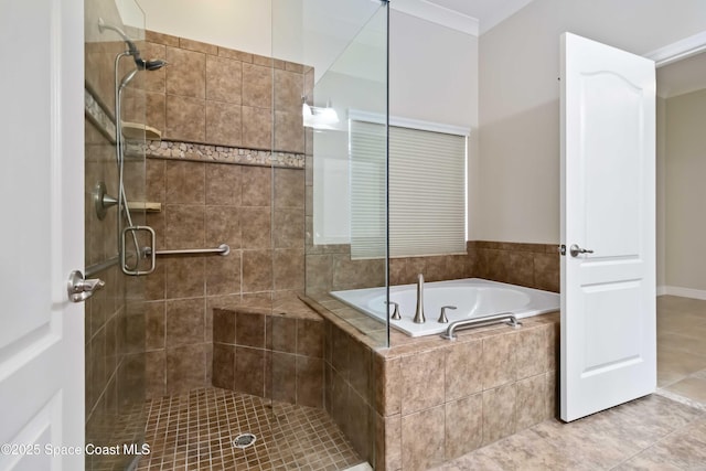3140 Constellation Dr, Melbourne, FL 32940 - full bath with tile patterned floors, a shower stall, and a bath