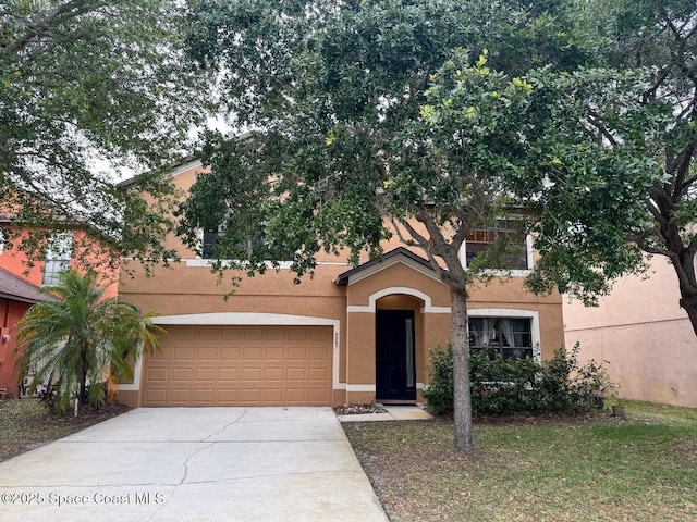 4345 Millicent Cir, Melbourne, FL 32901 - view of front facade featuring stucco siding and concrete driveway