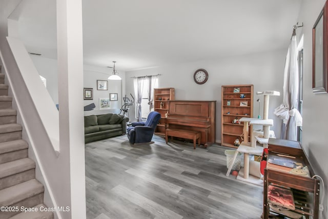 4345 Millicent Cir, Melbourne, FL 32901 - living room with stairway and wood finished floors