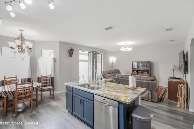 4345 Millicent Cir, Melbourne, FL 32901 - kitchen featuring stainless steel dishwasher, a chandelier, a sink, and light wood-style flooring