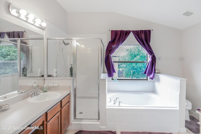 4345 Millicent Cir, Melbourne, FL 32901 - full bathroom with toilet, vanity, a stall shower, a bath, and lofted ceiling