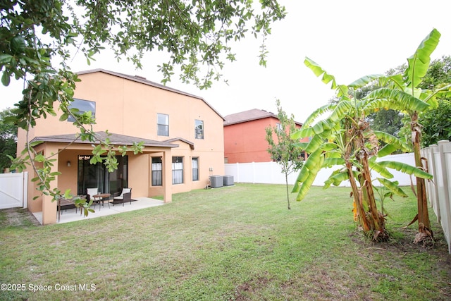 4345 Millicent Cir, Melbourne, FL 32901 - view of yard featuring a patio and central AC