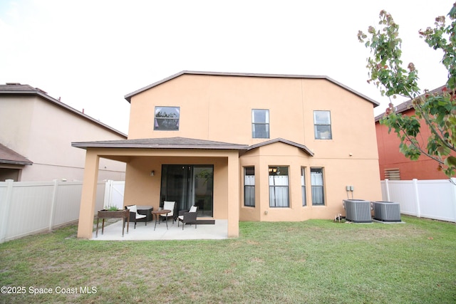 4345 Millicent Cir, Melbourne, FL 32901 - back of property with central AC unit, stucco siding, and a patio
