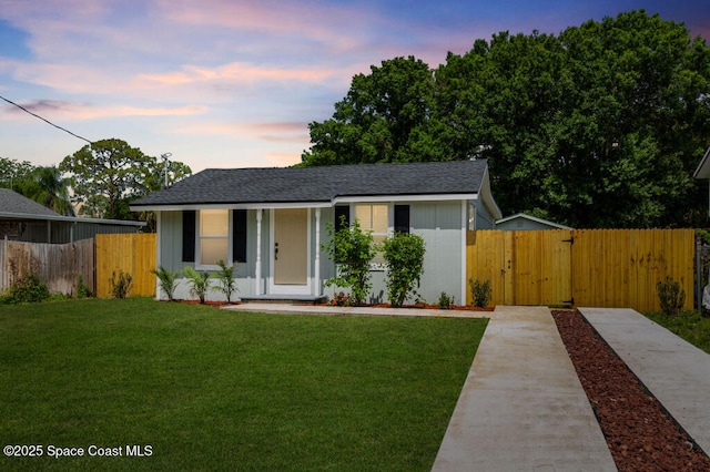 2295 Wood St, Melbourne, FL 32904 - view of front facade featuring a gate and a shingled roof