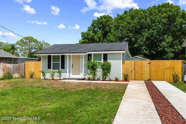 2295 Wood St, Melbourne, FL 32904 - view of front of property with a gate and roof with shingles