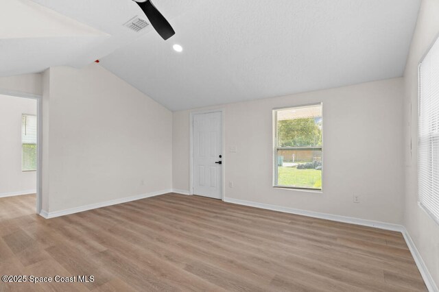 2295 Wood St, Melbourne, FL 32904 - spare room featuring a ceiling fan, lofted ceiling, light wood-type flooring, baseboards, and recessed lighting