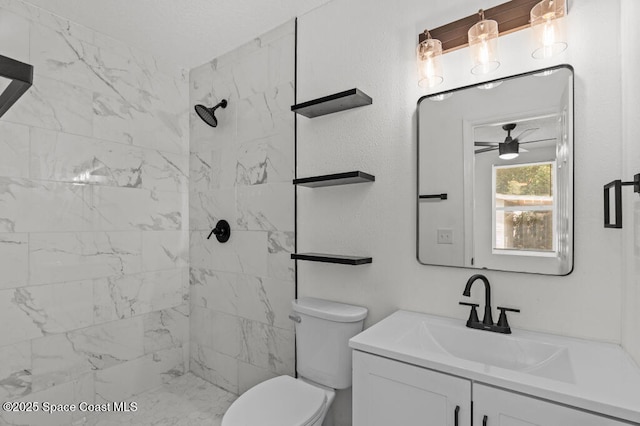 2295 Wood St, Melbourne, FL 32904 - bathroom featuring vanity, toilet, a tile shower, and ceiling fan