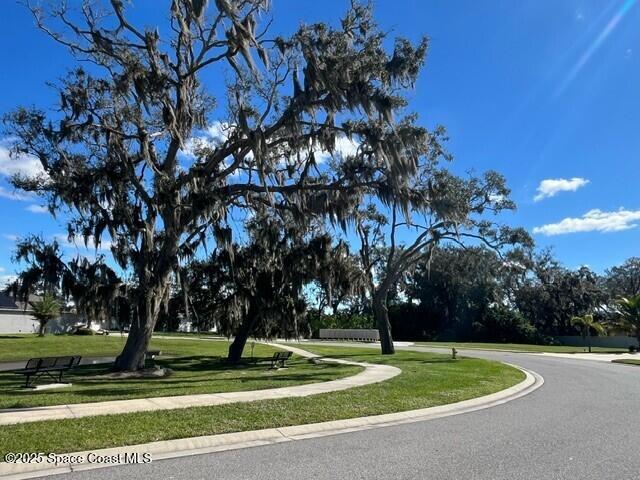 762 Clancy Ave NE, Palm Bay, FL 32905 - view of asphalt road featuring sidewalks