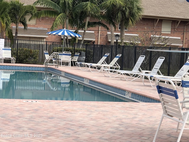 115 E Colonial Ct Unit C, Indian Harbour Beach, FL 32937 - community pool with a patio