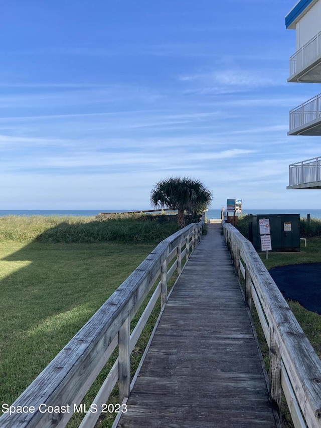 115 E Colonial Ct Unit C, Indian Harbour Beach, FL 32937 - view of property's community with a water view and a lawn
