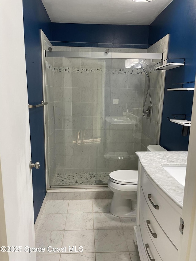 115 E Colonial Ct Unit C, Indian Harbour Beach, FL 32937 - full bath with vanity, marble look tiles, a shower stall, and toilet