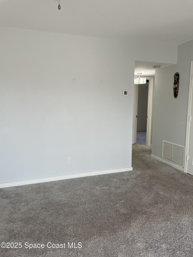115 E Colonial Ct Unit C, Indian Harbour Beach, FL 32937 - unfurnished room featuring carpet floors and baseboards