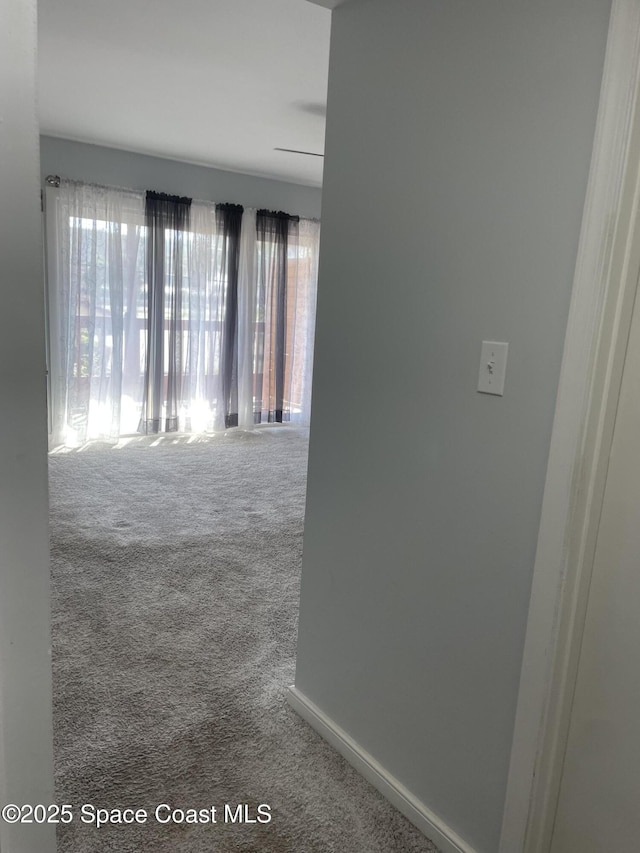 115 E Colonial Ct Unit C, Indian Harbour Beach, FL 32937 - hall featuring carpet and baseboards