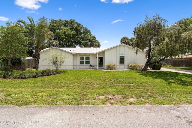 740 Hunan St NE, Palm Bay, FL 32907 - view of front of home with a metal roof