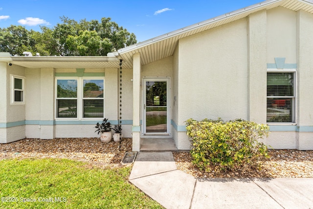 740 Hunan St NE, Palm Bay, FL 32907 - property entrance featuring stucco siding
