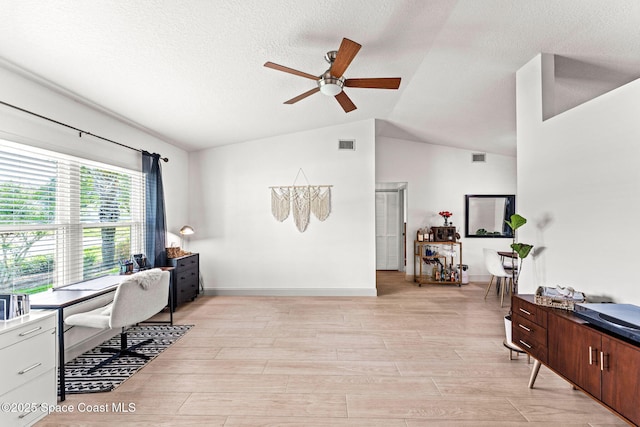 740 Hunan St NE, Palm Bay, FL 32907 - office with a ceiling fan, lofted ceiling, a textured ceiling, and light wood-style floors