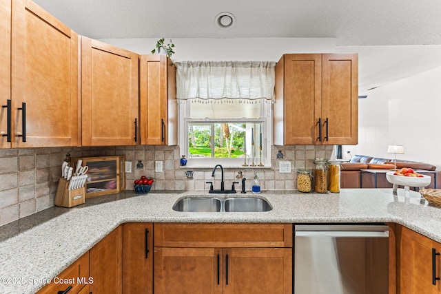 740 Hunan St NE, Palm Bay, FL 32907 - kitchen featuring stainless steel dishwasher, decorative backsplash, light stone countertops, and brown cabinets