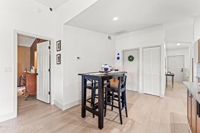 740 Hunan St NE, Palm Bay, FL 32907 - dining space with light wood-style floors and recessed lighting