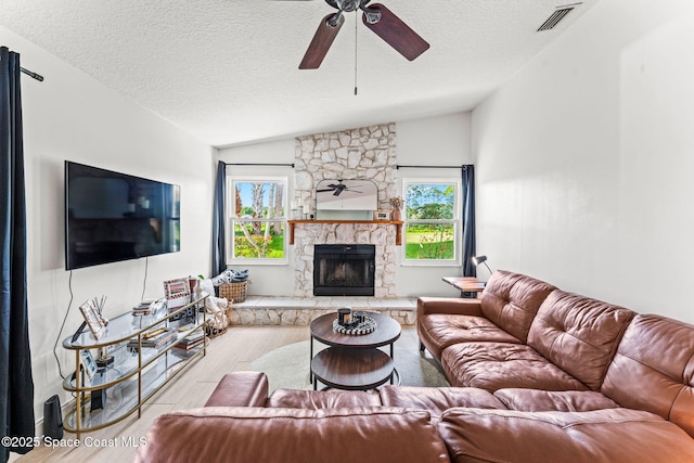 740 Hunan St NE, Palm Bay, FL 32907 - living area featuring a ceiling fan, wood finished floors, a textured ceiling, plenty of natural light, and lofted ceiling