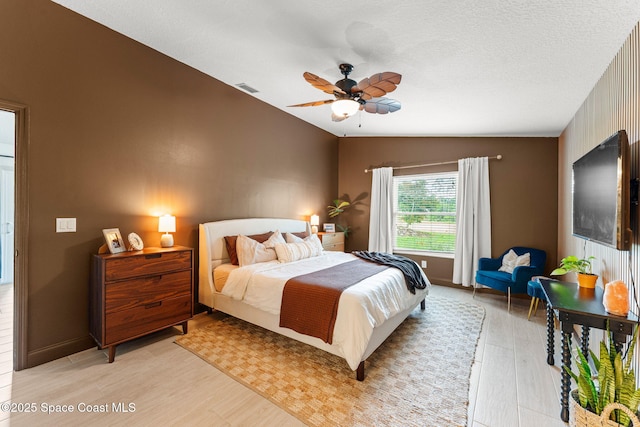 740 Hunan St NE, Palm Bay, FL 32907 - bedroom with light wood-style floors, lofted ceiling, and ceiling fan
