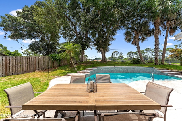 740 Hunan St NE, Palm Bay, FL 32907 - view of swimming pool featuring a fenced backyard, a patio, and outdoor dining space