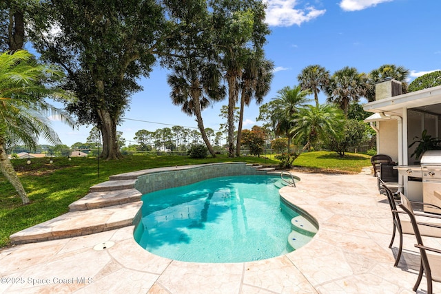 740 Hunan St NE, Palm Bay, FL 32907 - swimming pool featuring a patio and a lawn