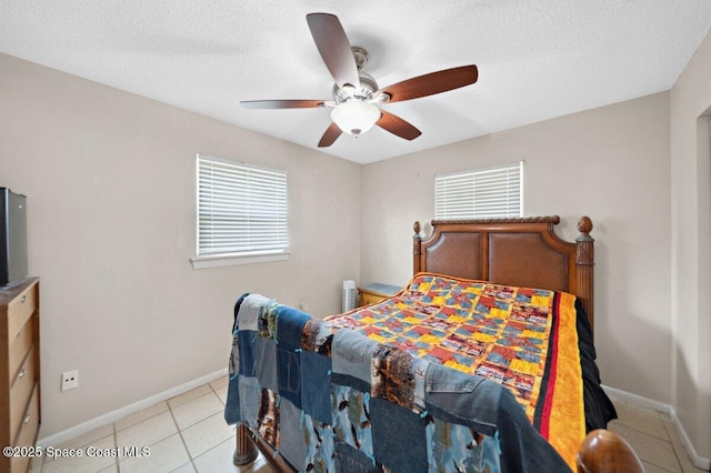 926 Caligula Ave SE, Palm Bay, FL 32909 - bedroom featuring light tile patterned flooring, baseboards, a textured ceiling, and a ceiling fan