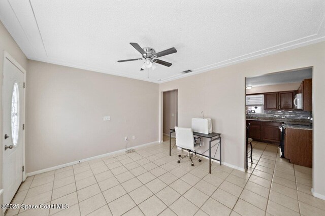 926 Caligula Ave SE, Palm Bay, FL 32909 - entrance foyer featuring ceiling fan, light tile patterned flooring, baseboards, and a textured ceiling