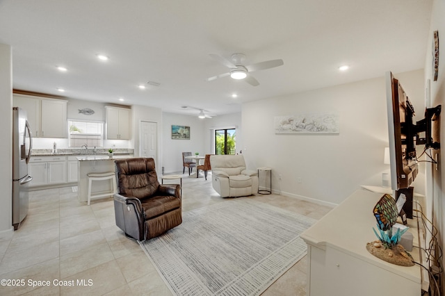 4299 Alligator Flag Cir, West Melbourne, FL 32904 - living area featuring a ceiling fan, plenty of natural light, light tile patterned floors, recessed lighting, and baseboards
