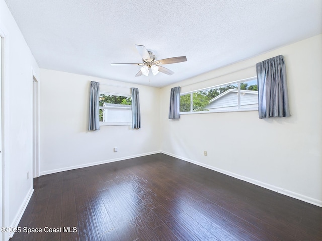 2115 Otterbein Ave, Cocoa, FL 32926 - empty room featuring ceiling fan, wood-type flooring, baseboards, and a textured ceiling