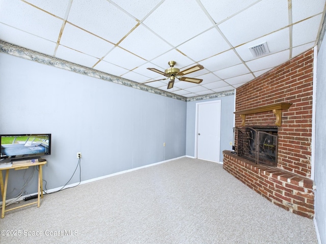 2115 Otterbein Ave, Cocoa, FL 32926 - unfurnished living room with carpet, a fireplace, a drop ceiling, and baseboards