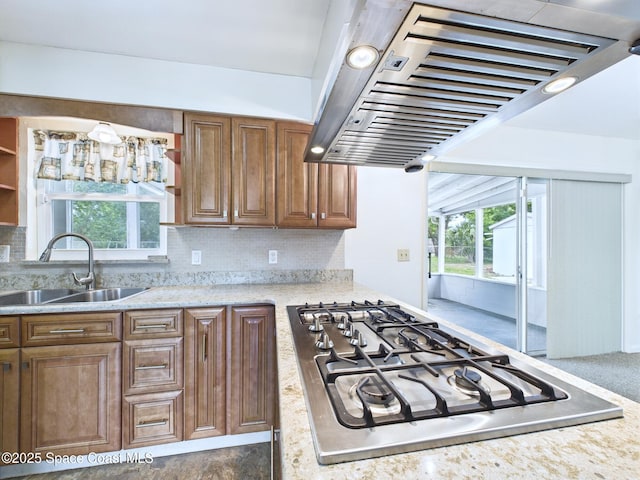 2115 Otterbein Ave, Cocoa, FL 32926 - kitchen featuring extractor fan, a sink, gas stovetop, backsplash, and brown cabinetry