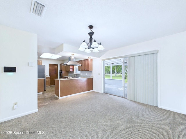 2115 Otterbein Ave, Cocoa, FL 32926 - unfurnished living room featuring a chandelier, light colored carpet, a sink, and baseboards