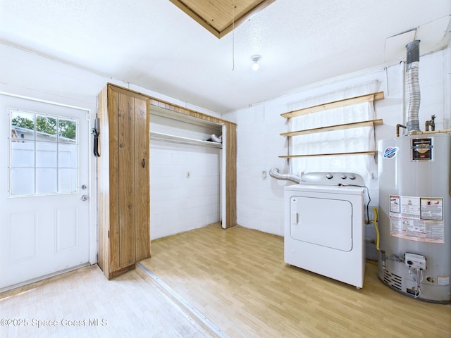 2115 Otterbein Ave, Cocoa, FL 32926 - laundry room featuring washer / clothes dryer, gas water heater, and light wood-style floors