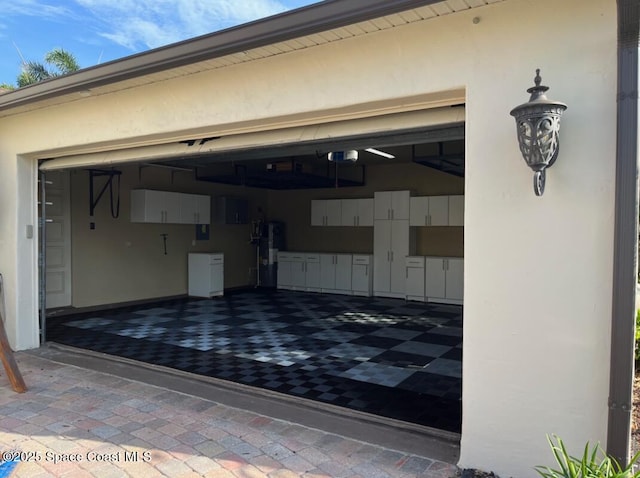 3180 Savannahs Trl, Merritt Island, FL 32953 - garage featuring a garage door opener